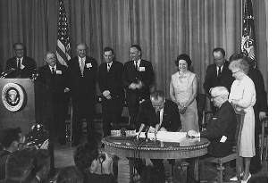 President Johnson signing Medicare legislation